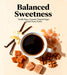 Cup of coffee with vanilla beans, caramel, and walnuts on a beige background.